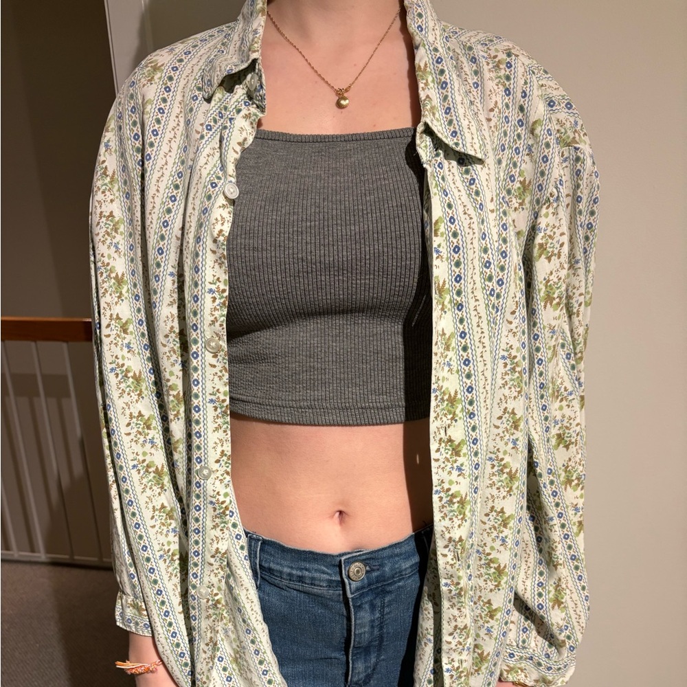 Floral women’s button-down. White with green and blue floral patterns.